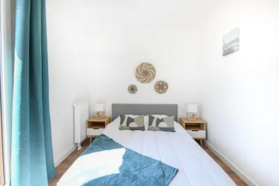 Un ou plusieurs lits dans un hébergement de l'établissement Le Coquillage - Joli T3 avec grand balcon