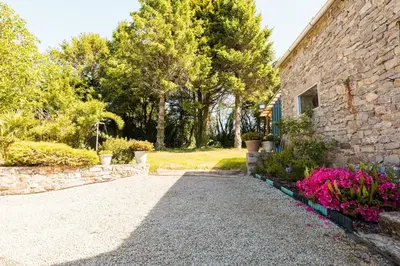 Jardin de l'établissement Maison spacieuse avec jardin - 10 min plage
