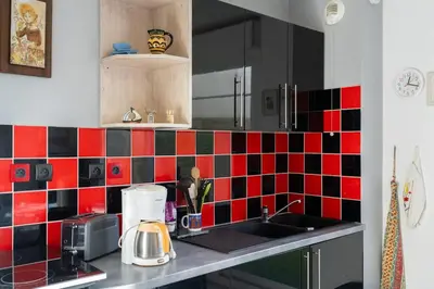 Cuisine ou kitchenette dans l'établissement Appartement avec jardin et plage