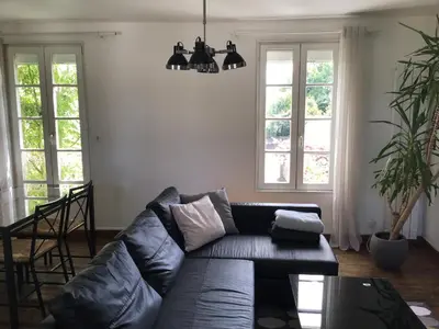 Coin salon dans l'établissement Maison De ville Bayeux