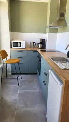 Cuisine ou kitchenette dans l'établissement Bayeux garden