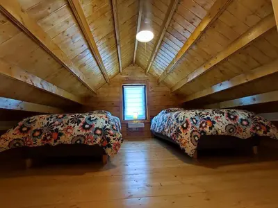 Un ou plusieurs lits dans un hébergement de l'établissement Le chalet de Joyce spa et piscine