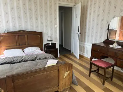 Un ou plusieurs lits dans un hébergement de l'établissement Petit manoir av court de tennis