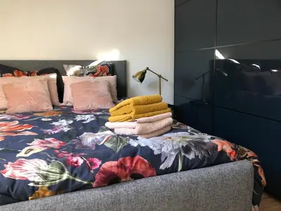 Un ou plusieurs lits dans un hébergement de l'établissement appartement cosy