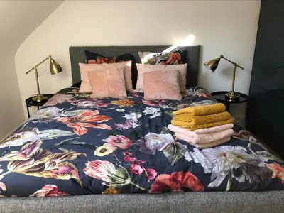 Un ou plusieurs lits dans un hébergement de l'établissement appartement cosy
