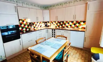 Cuisine ou kitchenette dans l'établissement L'escapade du Mont