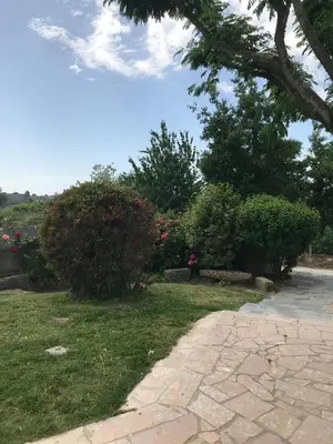 Jardin de l'établissement Maison traditionnelle en pierre - Penn'ti