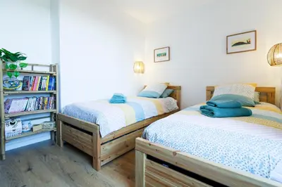 Un ou plusieurs lits dans un hébergement de l'établissement Appartement Aloha - Proche du Port de Carteret