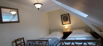 Un ou plusieurs lits dans un hébergement de l'établissement Les Ecuries du Chateau