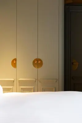 Un ou plusieurs lits dans un hébergement de l'établissement Hôtel La Particulière