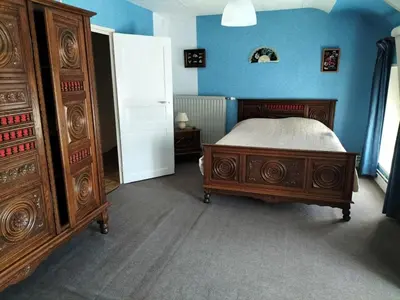 Un ou plusieurs lits dans un hébergement de l'établissement Charmante maison dans le bocage proche A84