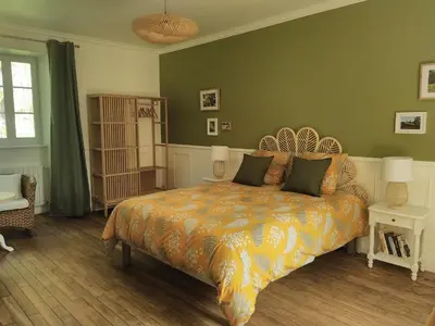 Un ou plusieurs lits dans un hébergement de l'établissement Chambre d'hôtes Côté Jardin