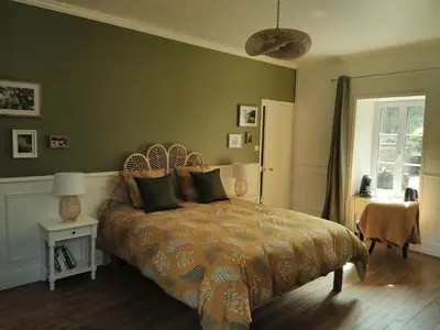 Un ou plusieurs lits dans un hébergement de l'établissement Chambre d'hôtes Côté Jardin