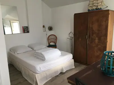 Un ou plusieurs lits dans un hébergement de l'établissement STUDIO entrée de plage-parking gratuit
