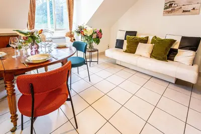 Coin salon dans l'établissement Apartment Douillet