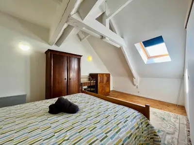 Un ou plusieurs lits dans un hébergement de l'établissement The Duplex des Flots In the heart of Grandcamp just steps from the beach