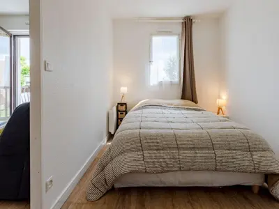 Un ou plusieurs lits dans un hébergement de l'établissement Apartment Cabourg Plage-24 by Interhome