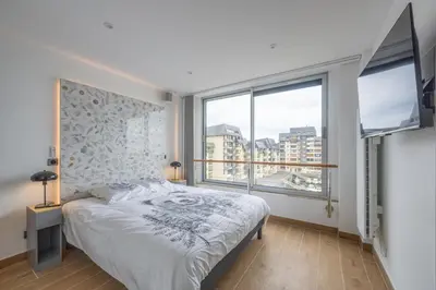 Un ou plusieurs lits dans un hébergement de l'établissement Le penthouse des ours