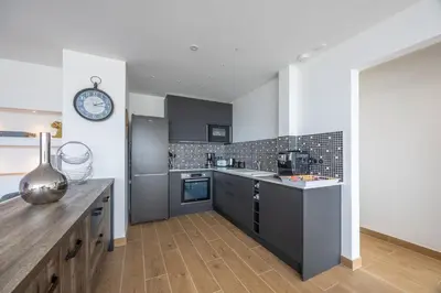 Cuisine ou kitchenette dans l'établissement Le penthouse des ours