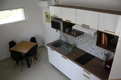 Cuisine ou kitchenette dans l'établissement La boutique des Roches