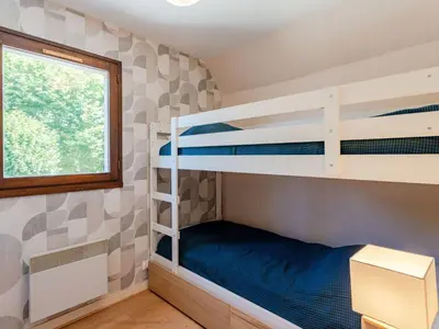 Un ou plusieurs lits dans un hébergement de l'établissement Apartment La Guillaumière-3 by Interhome