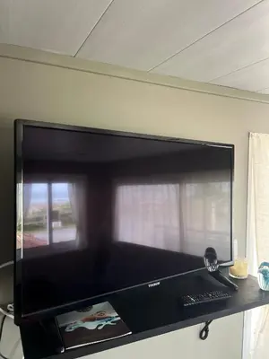 Télévision ou salle de divertissement dans l'établissement Le Ribeiro, Maison vue sur mer - 30m de la plage