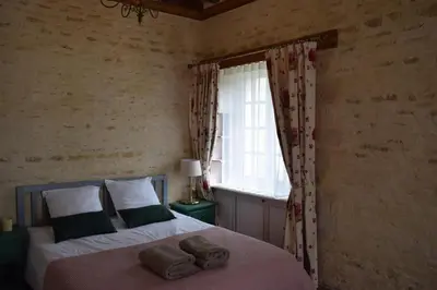 Un ou plusieurs lits dans un hébergement de l'établissement Château de Canon - le Logis d'Antoinette