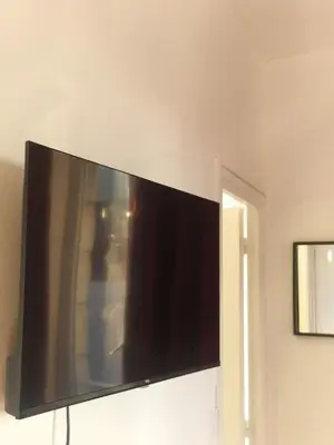 Télévision ou salle de divertissement dans l'établissement Logement élégant au cœur de CAEN