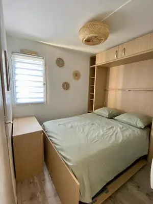 Un ou plusieurs lits dans un hébergement de l'établissement L instant Cabourg appartement vue mer
