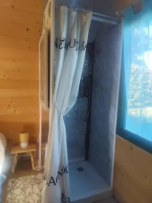 Un ou plusieurs lits dans un hébergement de l'établissement Chalet fleuri