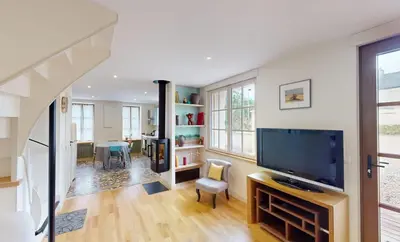 Télévision ou salle de divertissement dans l'établissement Au bord de l'Odon