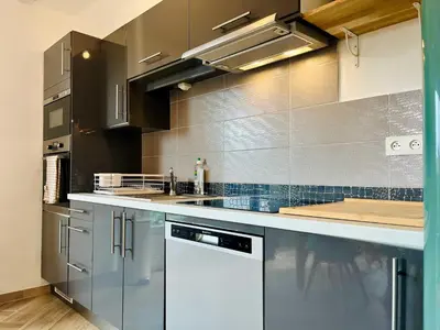 Cuisine ou kitchenette dans l'établissement La Dune - Maison au bord de l'eau