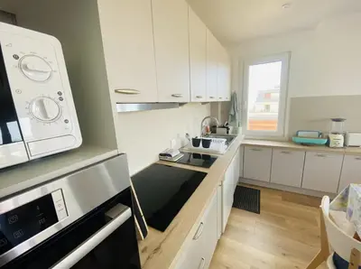 Cuisine ou kitchenette dans l'établissement Le Spacieux vue mer
