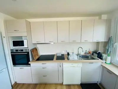 Cuisine ou kitchenette dans l'établissement Le Spacieux vue mer