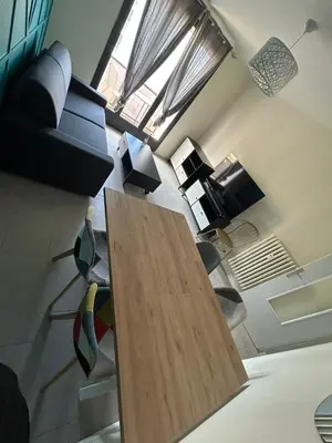 Coin salon dans l'établissement T2 moderne proche centre avec balcon et wifi