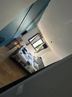 Un ou plusieurs lits dans un hébergement de l'établissement T2 moderne proche centre avec balcon et wifi