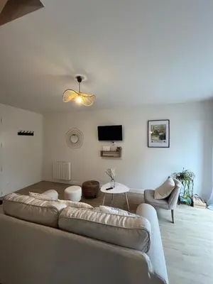 Télévision ou salle de divertissement dans l'établissement Le Cottage
