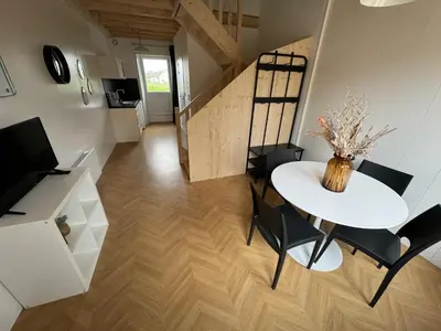 Télévision ou salle de divertissement dans l'établissement Apparthôtel Mont Saint Michel - Résidence Fleurdumont