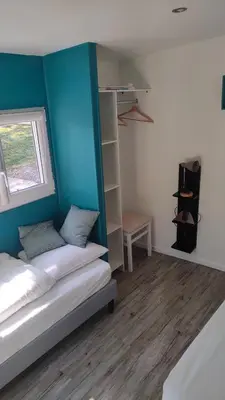 Un ou plusieurs lits dans un hébergement de l'établissement Maison bord de mer
