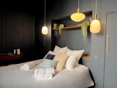 Un ou plusieurs lits dans un hébergement de l'établissement Suite Romantique, hyper centre