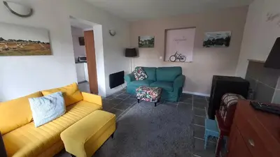Coin salon dans l'établissement Magnolia - Cozy 3 star Cottage with heated pool and hot tub
