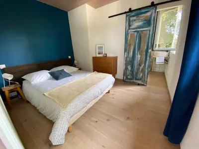 Un ou plusieurs lits dans un hébergement de l'établissement Charmant appartement Carolles