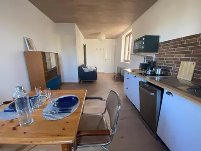 Cuisine ou kitchenette dans l'établissement Charmant appartement Carolles