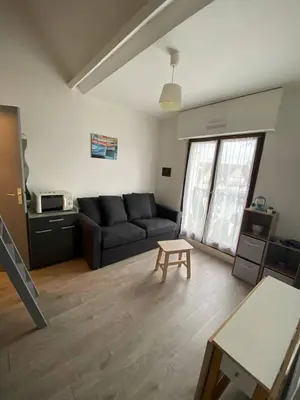 Coin salon dans l'établissement Appartement Cabourg Plage - F2 - Vue dégagée