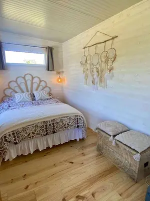Un ou plusieurs lits dans un hébergement de l'établissement Mimi's tiny house