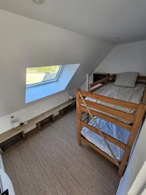 Un ou plusieurs lits dans un hébergement de l'établissement Lodge vue sur mer