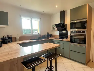 Cuisine ou kitchenette dans l'établissement Maison T5 