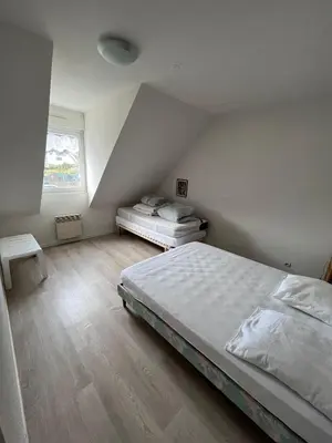 Un ou plusieurs lits dans un hébergement de l'établissement Maison de vacances accès direct plage residence sécurisée