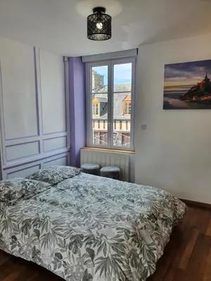 Un ou plusieurs lits dans un hébergement de l'établissement Appartement de la cour du Haut Manoir
