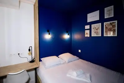 Un ou plusieurs lits dans un hébergement de l'établissement La Tour Napoléonienne et son Jacuzzi
